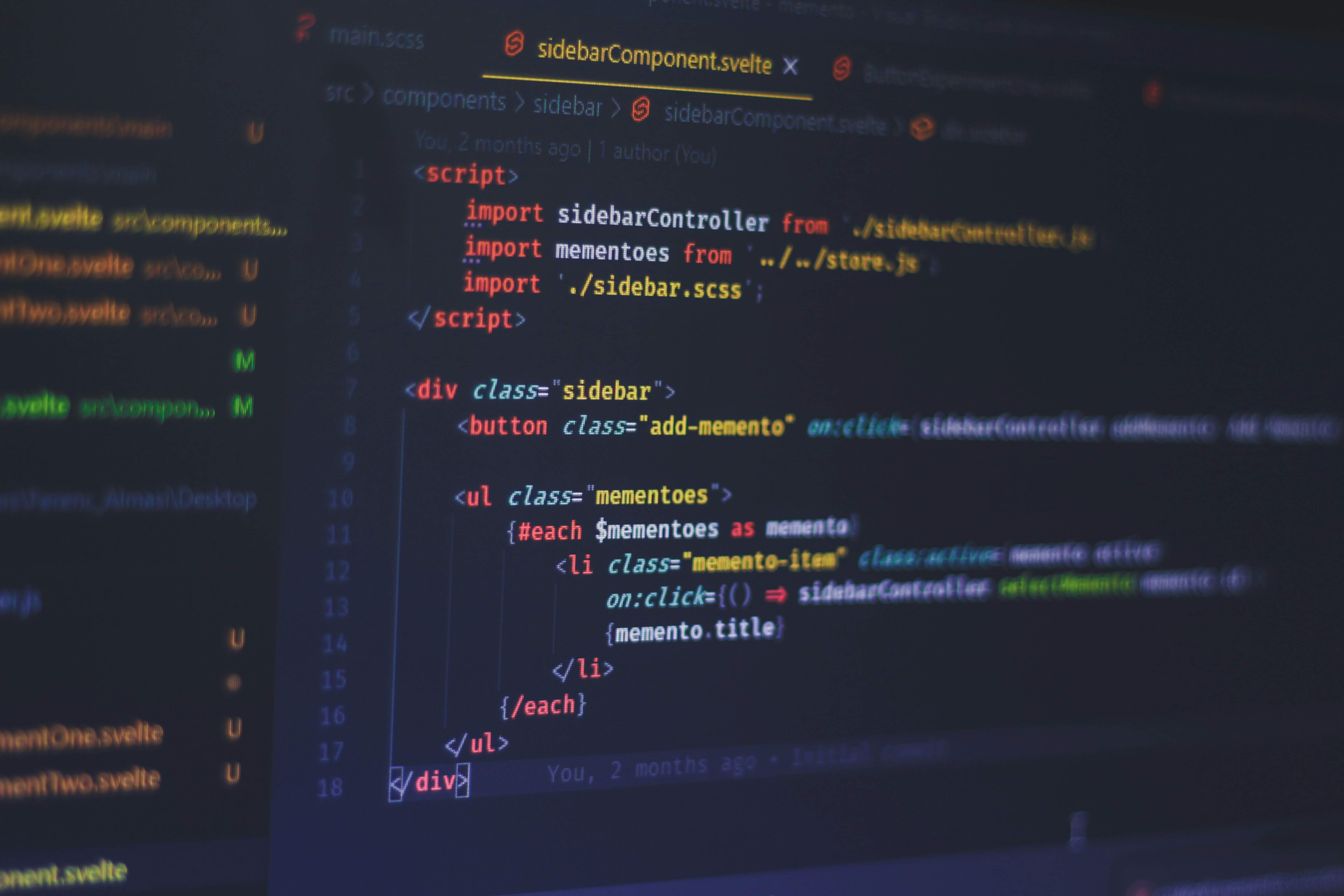 AI website builder comparison showing code development - Photo by Ferenc Almasi on Unsplash